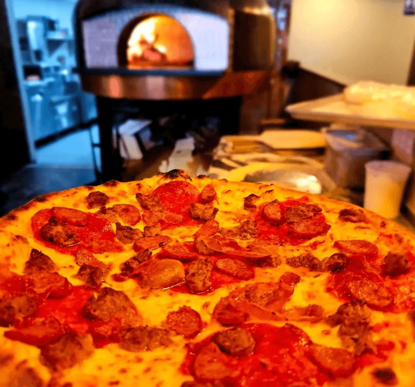 Fresh pizza in front of the Lollipops oven