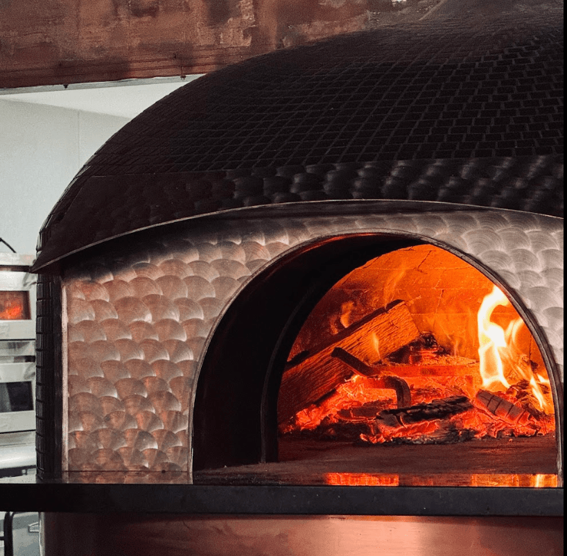 Fire burning inside the Lollipops woodfire oven